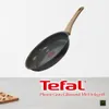 A frying pan with a wooden handle is shown against a white background, with text and a logo at the bottom. Náhľad obrázku produktu