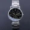 A close-up studio shot of a silver analog wristwatch with a black face. Produktbild-Vorschau
