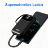 A black power bank is connected to a smartphone, showing the charging status on both devices. Produktbild-Vorschau