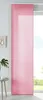 A pink sliding curtain hangs in front of a window, with a small table and plant to the left.