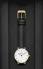 A Daniel Wellington watch is displayed in a black box. Produktbild-Vorschau
