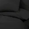 A close-up view of a black duvet and pillow, showing the texture of the fabric. Náhľad obrázku produktu
