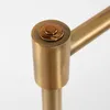 Close-up of a brass-colored joint mechanism on a lamp. Produktbild-Vorschau