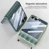 Two phone cases are shown on a light gray surface. One case is dark green and folded, while the other is clear with a green trim and shows a magnetic charging feature with blue lightning graphics. Produktbild-Vorschau