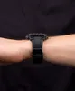 A close-up shot of a black Casio Edifice Bluetooth watch on a person's wrist against a black background. Voir les images du produit