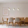 A dining room setting with a table, chairs, and a pendant light fixture. Produktbild-Vorschau