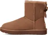 A single brown Ugg boot with a bow on the back, shown from the side against a white background. Anteprima dell’immagine prodotto