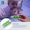 A baby is lying on its stomach while a hand holds a digital thermometer near it. Produktbild-Vorschau