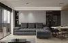 A modern living room with a sectional sofa, dining table, and kitchen area.