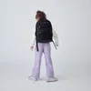 A young person wearing a backpack. Náhľad obrázku produktu