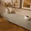 A modern living room with a lowboard, vases, and artwork. Produktbild-Vorschau