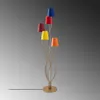 A multi-colored floor lamp with five lampshades on a grey background. Produktbild-Vorschau