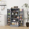 A gray pantry cabinet filled with various food items and kitchenware, placed in a room with white walls and a tiled backsplash. Produktbild-Vorschau
