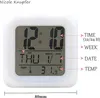 A digital clock displaying time, date, and temperature, with labels pointing to each function. Produktbild-Vorschau