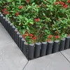 A garden bed with red flowers and green leaves, bordered by dark gray plastic edging. Náhled obrázku produktu