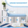 A white storage bench with blue cushions and shelves, displaying books and decorative items. Produktbild-Vorschau