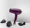 A purple hairdryer with gold accents and three attachments displayed on a white surface with a light gray background. Podgląd zdjęcia produktu