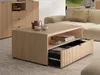 A modern living room scene featuring a light wood coffee table with an open drawer, a sofa, and a cabinet in the background. Náhľad obrázku produktu