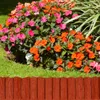 A garden bed with colorful flowers and a wooden-look plastic border. Produktbild-Vorschau