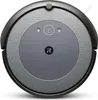 A top-down view of a robotic vacuum cleaner on a white background. Voir les images du produit