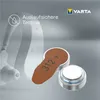 A hearing aid and two batteries are shown against a light gray background. Produktbild-Vorschau