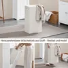 A collage of images showing a white bathroom cabinet with a removable laundry basket and a person using it. Produktbild-Vorschau