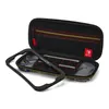 An open Nintendo Switch Lite carrying case with accessories. Produktbild-Vorschau