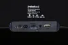 A close-up view of the ports and labels on the back of a black Bluetooth speaker. Produktbild-Vorschau