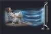 A woman relaxing while a fan blows air towards her, with stylized air currents depicted. Produktbild-Vorschau