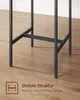 Close-up of the black metal legs of a table or bar stool set on a wooden floor. Produktbild-Vorschau