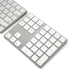 Two silver keyboards are shown from a diagonal angle on a white background. Náhled obrázku produktu
