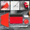 Rotes Vinyl-Folien-Werkzeugset mit Rakeln, Cuttermesser, Ersatzklingen und Maßband auf einer Marmorarbeitsplatte Anteprima dell’immagine prodotto