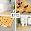 A collage of images showing a bamboo bath mat in different bathroom settings and close-ups. Voir les images du produit