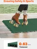 A person wearing roller skates is standing on green interlocking floor tiles. Podgląd zdjęcia produktu