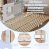 A bed safety rail is shown with installation instructions. Voir les images du produit