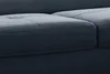 A close-up view of a dark gray sofa's corner and cushions. Produktbild-Vorschau