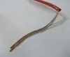 A close-up of the end of a heating element with two wires and gold-colored connectors. Anteprima dell’immagine prodotto