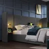 A bedroom scene featuring a bed with integrated nightstands and lighting. Anteprima dell’immagine prodotto