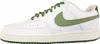 A side view of a white Nike Court Vision Low sneaker with green accents. Produktbild-Vorschau