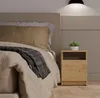 A bedroom scene with a bed and a nightstand. Anteprima dell’immagine prodotto