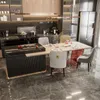 A modern kitchen and dining area with chairs around a table. Voir les images du produit