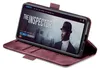 A smartphone in a burgundy flip case is displayed on a white background, showing a movie streaming interface on its screen. Produktbild-Vorschau