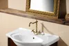 A close-up view of a bathroom sink with a vintage-style faucet. Anteprima dell’immagine prodotto