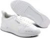 A pair of white Puma R78 SL Runner Uni sneakers are shown from a slightly elevated angle against a white background. One shoe is upright and laced, while the other is shown from the sole up. Podgląd zdjęcia produktu