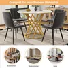 A round dining table with four chairs, shown in a room setting, with smaller inset images showing different room applications. Voir les images du produit