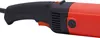 A close-up view of the handle and part of the body of a red and black power tool. Podgląd zdjęcia produktu