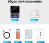 A collage of images showing a handheld gaming console and its accessories. Produktbild-Vorschau
