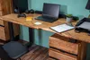 A home office setup with a wooden desk, laptop, and chair. Produktbild-Vorschau