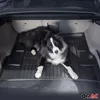 A dog is lying in the trunk of a car on a black rubber mat. Produktbild-Vorschau