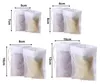 Four pairs of small white mesh bags with drawstring closures, each pair labeled with dimensions. Produktbild-Vorschau